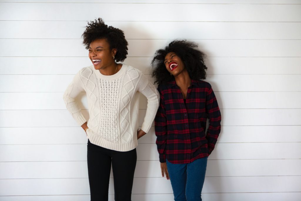 Two women sharing a supportive moment during recovery and healing